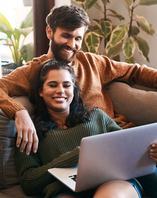 Young couple looking at laptop