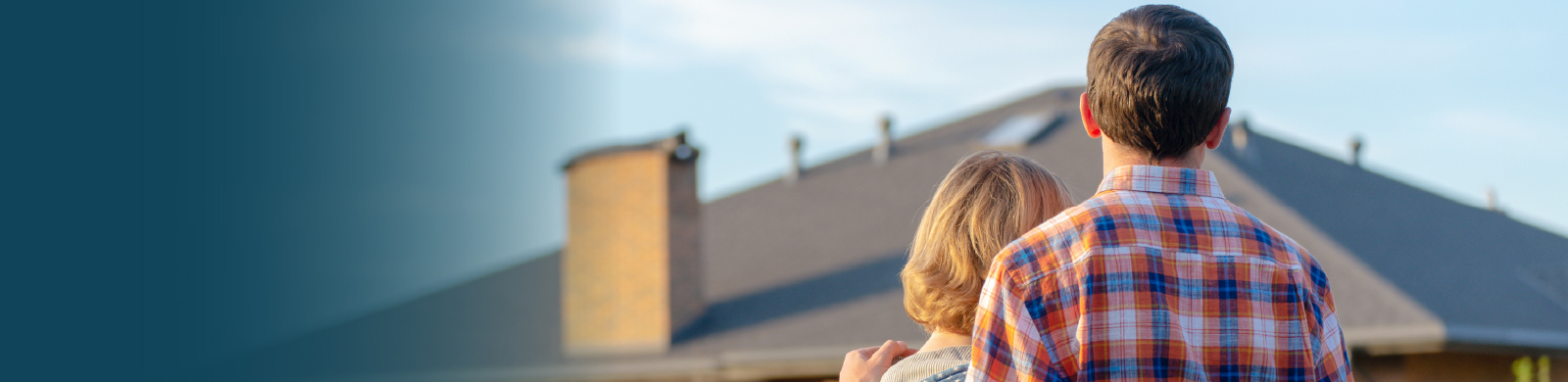 Young couple looking at house