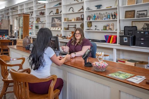 Customer being serviced at front desk of bank